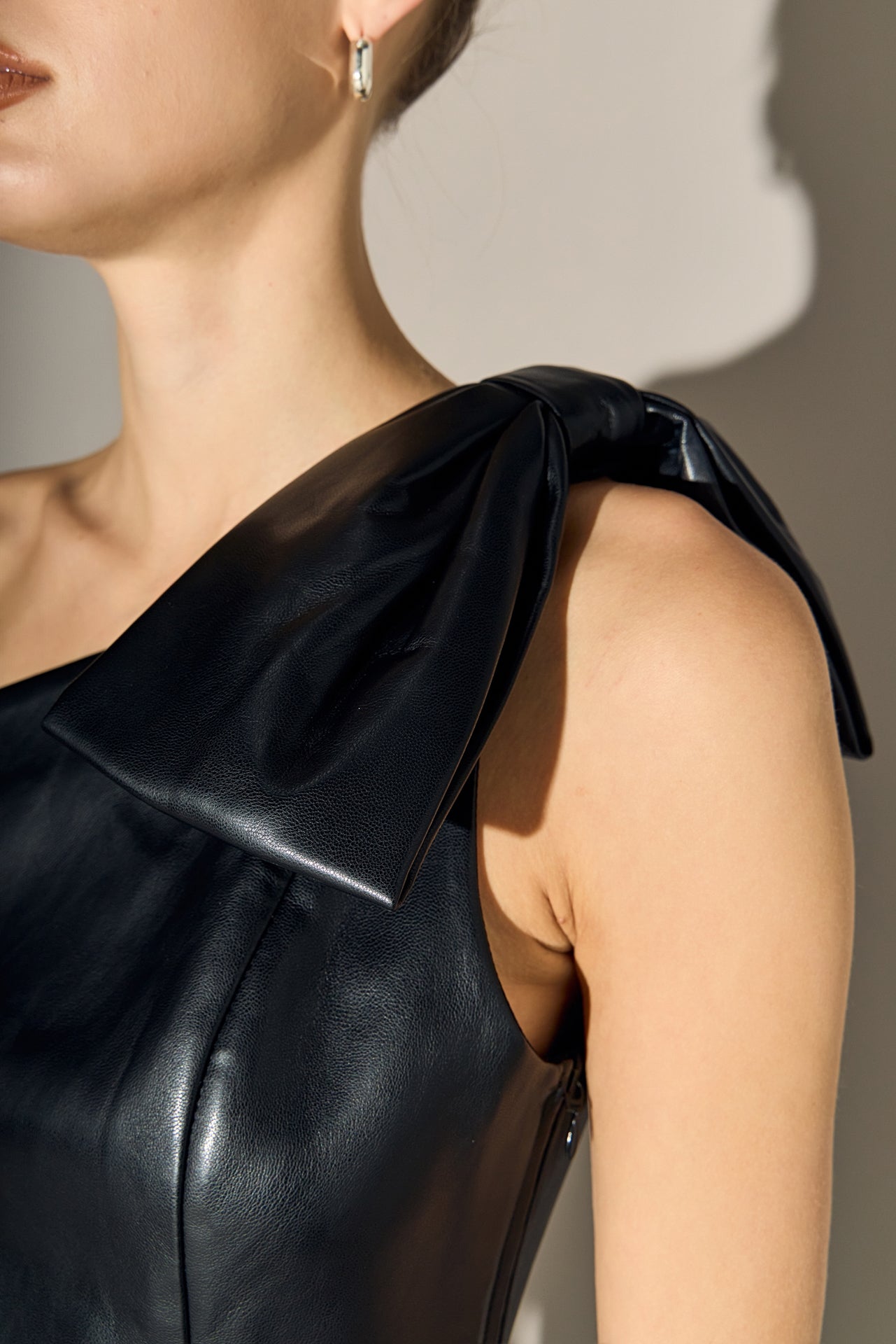 Asymmetric Faux Leather Top with Bow Tie