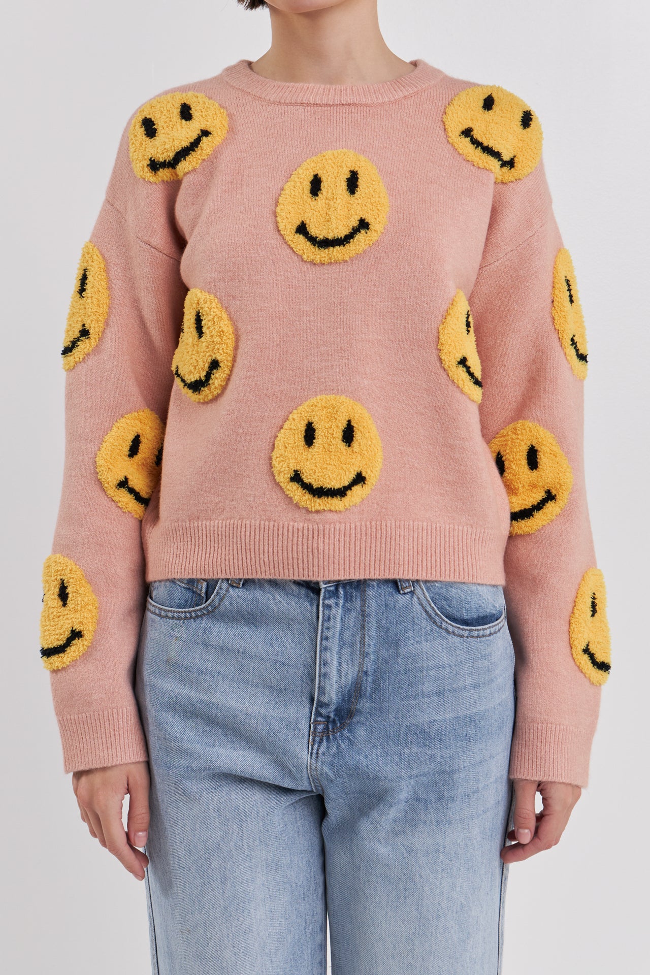 Suéter con cara sonriente